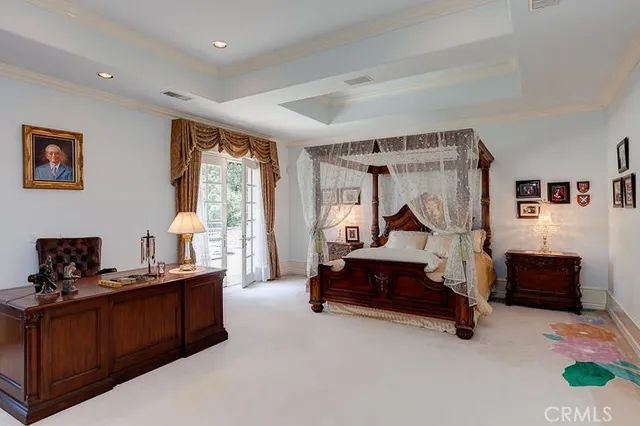 a bedroom with furniture and windows