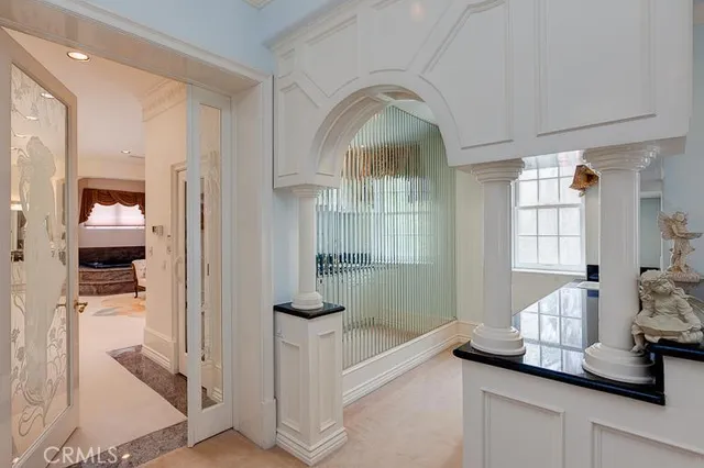 a view of hall way with entryway and front door