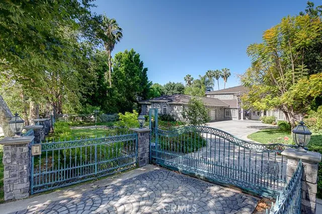 a view of a wrought iron fences in front of house