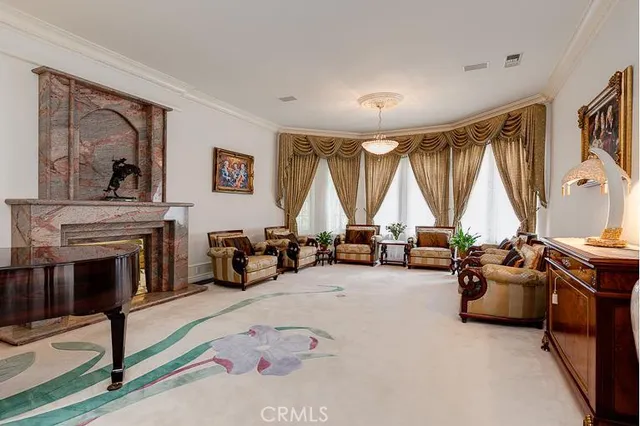 a view of a livingroom with furniture and a fireplace