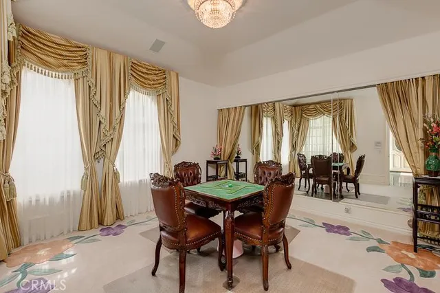 a view of a dining room with furniture and window