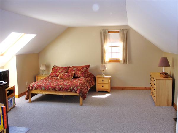 578 Huckins Neck Road Barnstable, MA 02632 - Photo 11 of 13 a spacious bedroom with a bed and a window