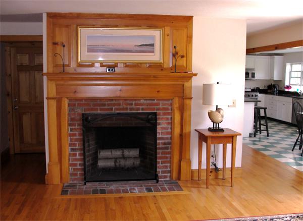 578 Huckins Neck Road Barnstable, MA 02632 - Photo 5 of 13 a living room with furniture and a fireplace