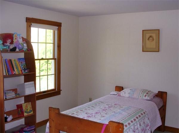 578 Huckins Neck Road Barnstable, MA 02632 - Photo 10 of 13 a bedroom with a bed and a window