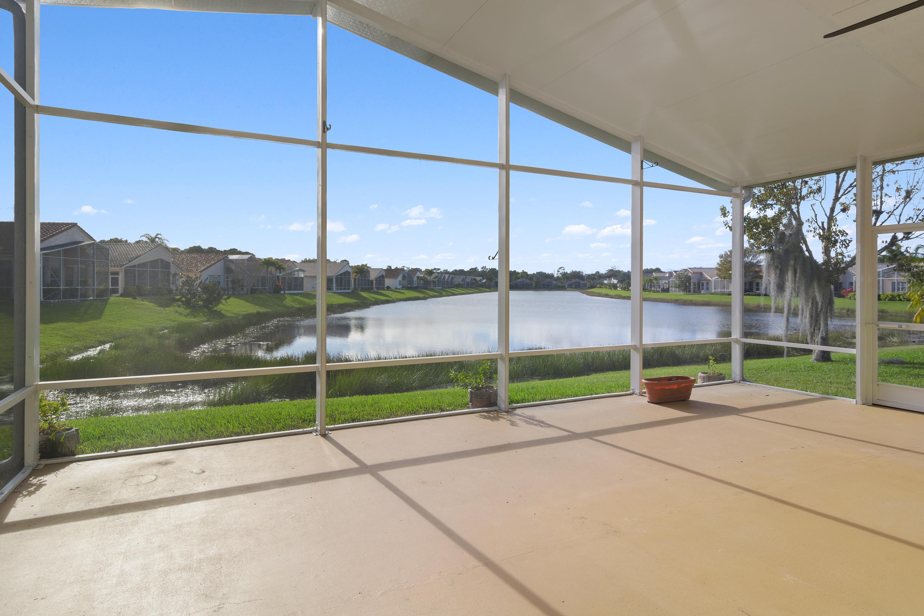 422 Springview Loop Port St. Lucie, FL 34986 - Photo 3 of 35 Back Covered Patio