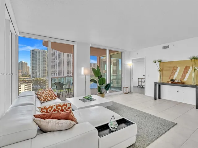 a kitchen with stainless steel appliances kitchen island granite countertop a sink and cabinets