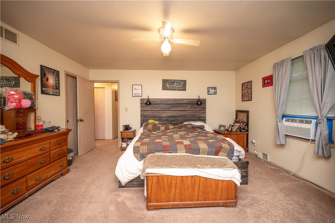 5546 Shaffer Road Northwest, Unit A & B Warren, OH 44481 - Photo 12 of 47 Bedroom with carpet flooring, a ceiling fan, and cooling unit