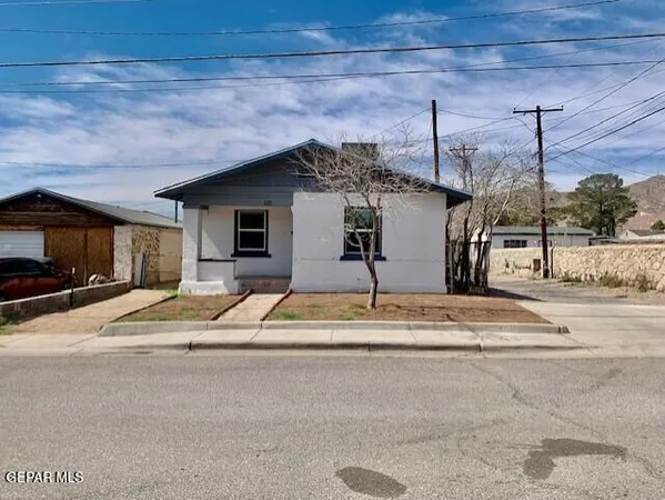 a view of a house with a road