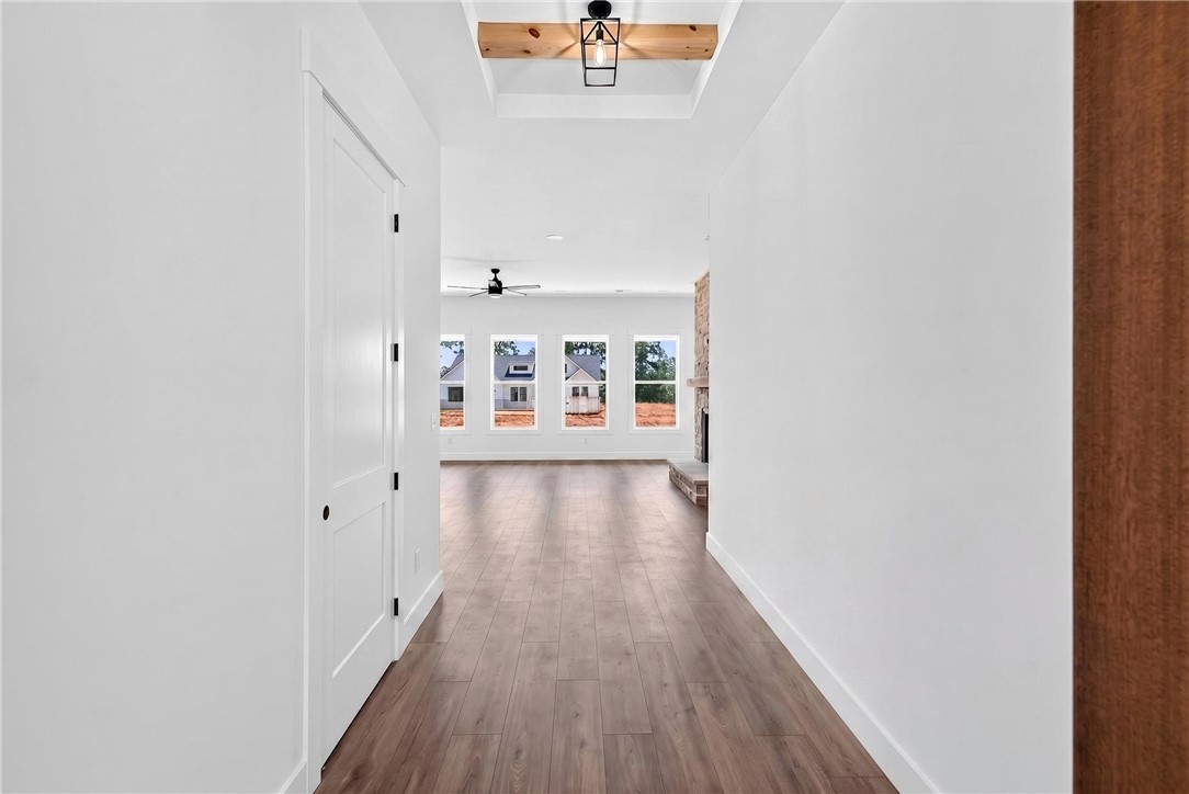 424 Blume Road Anderson, SC 29625 - Photo 5 of 30 A spacious entry leads to an inviting living area with a stone fireplace and abundant natural illumination.
