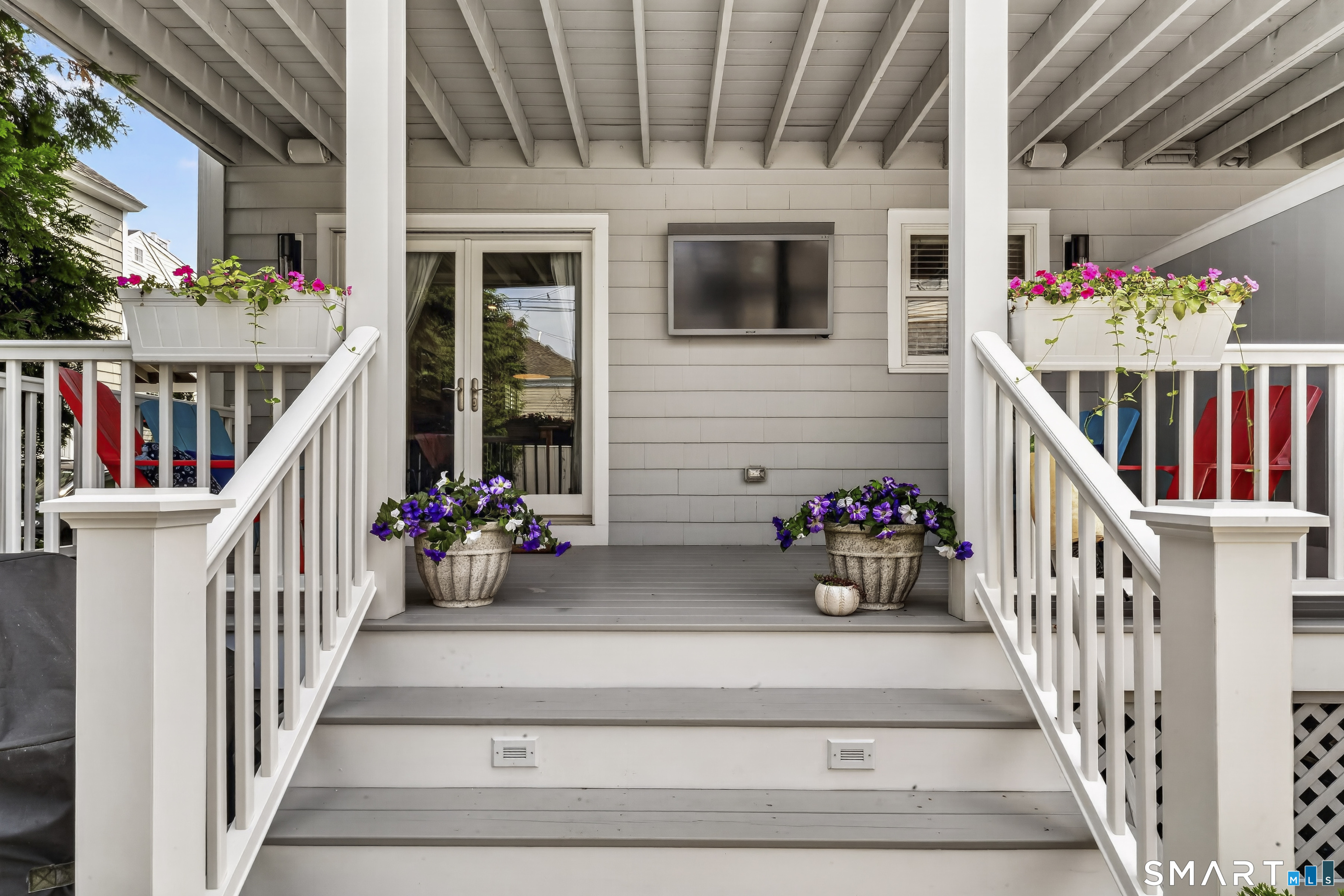 679 Fairfield Beach Road, Unit 679 Fairfield, CT 06824 - Photo 32 of 38 Rear porch/patio with outdoor TV.
