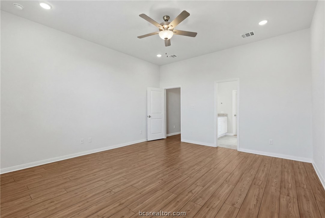 1922 Viva Road Bryan, TX 77807 - Photo 43 of 45 Spacious downstairs primary suite tucked away off the living room in a desirable split floor plan.