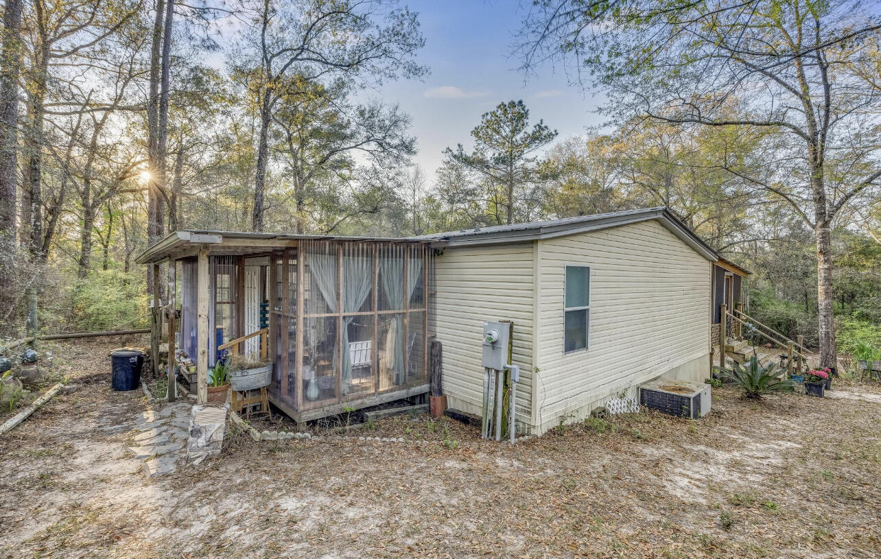 5084 Richardson Road Crestview, FL 32539 - Photo 19 of 24 a view of a house with a yard