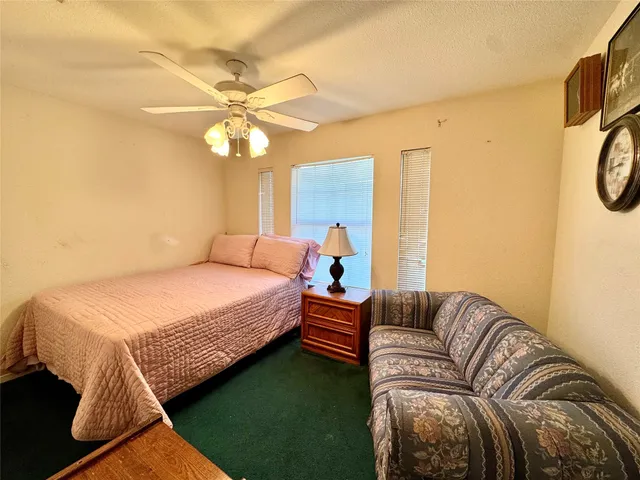 a bedroom with a bed and balcony