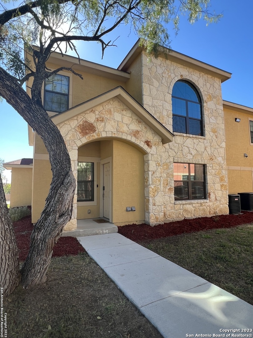 a view of a house with a yard