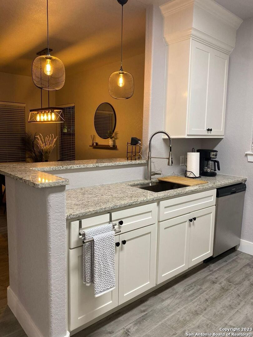 6160 Eckhert Road, Unit 1406 San Antonio, TX 78240 - Photo 7 of 14 a kitchen with a sink and a stove
