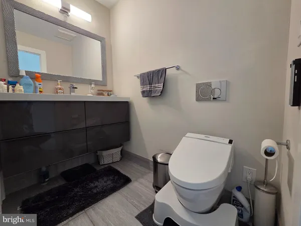 a bathroom with a toilet and a sink