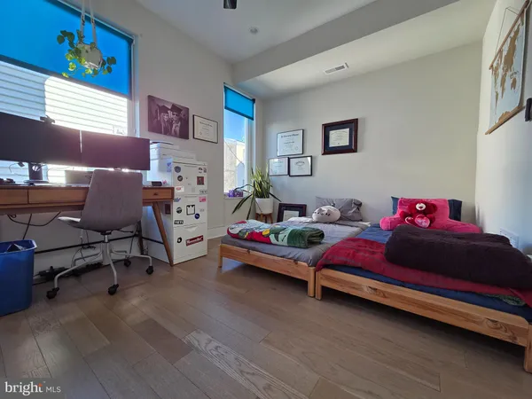 a bedroom with furniture and a window