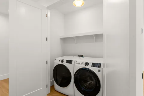 a bathroom with a tub sink and vanity