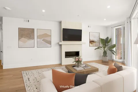 a living room with furniture fireplace and a flat screen tv