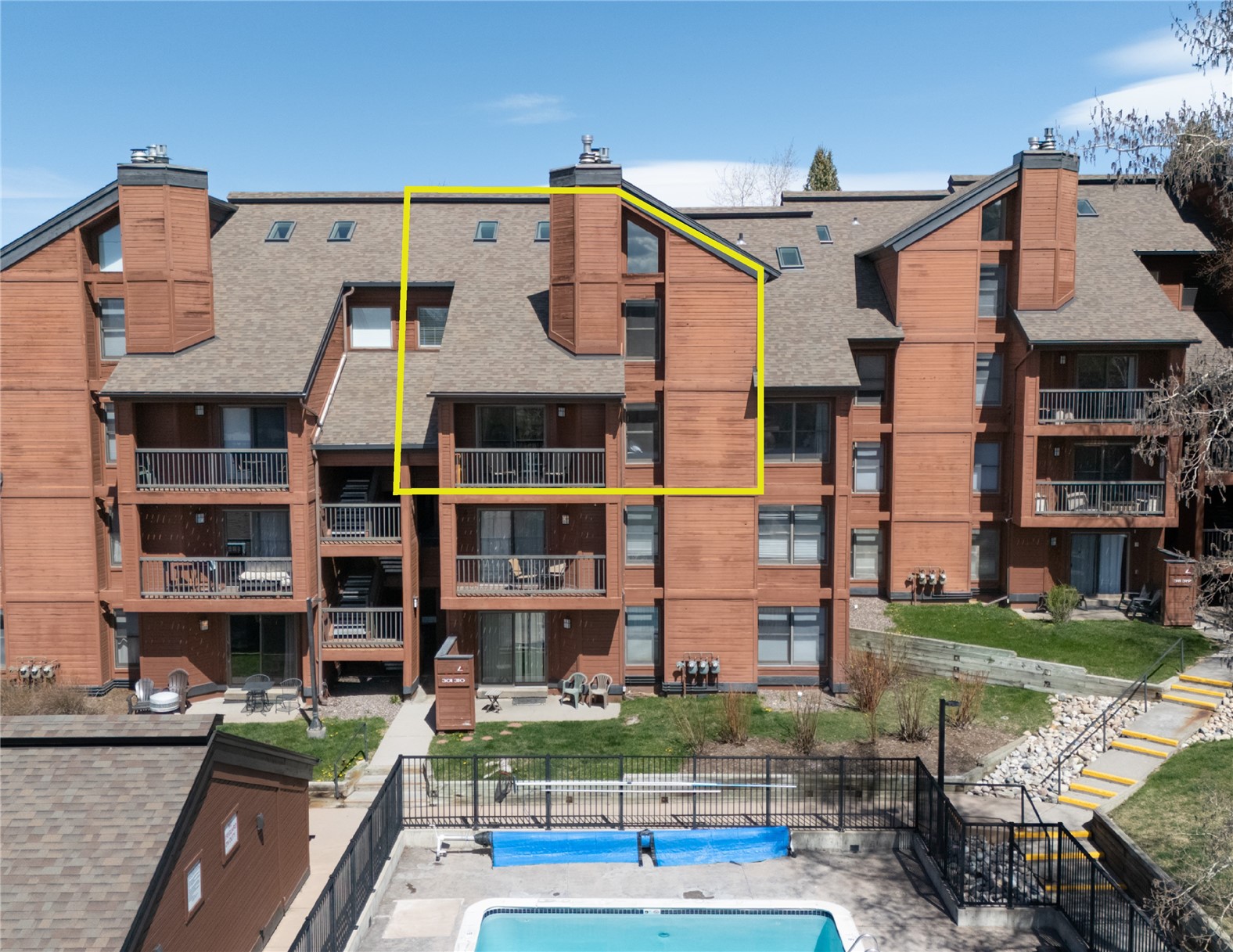 2025 Walton Creek Road, Unit 308 Steamboat Springs, CO 80487 - Photo 1 of 34 a view of a big building with many windows