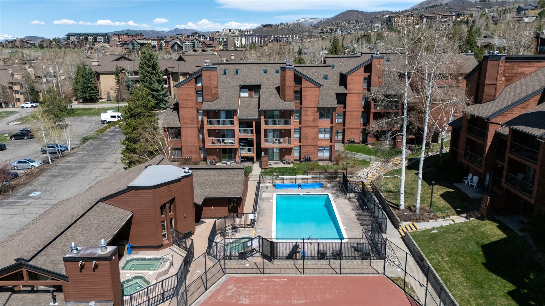 2025 Walton Creek Road, Unit 308 Steamboat Springs, CO 80487 - Photo 25 of 34 a view of multiple houses with a yard