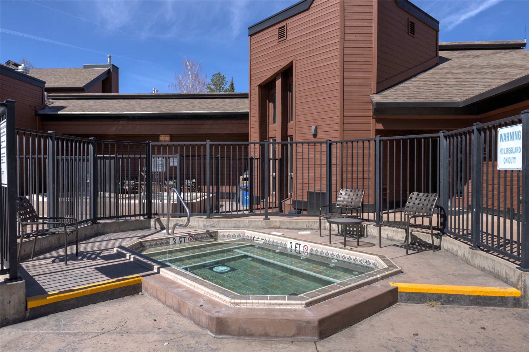 2025 Walton Creek Road, Unit 308 Steamboat Springs, CO 80487 - Photo 28 of 34 a view of a house with swimming pool and sitting area