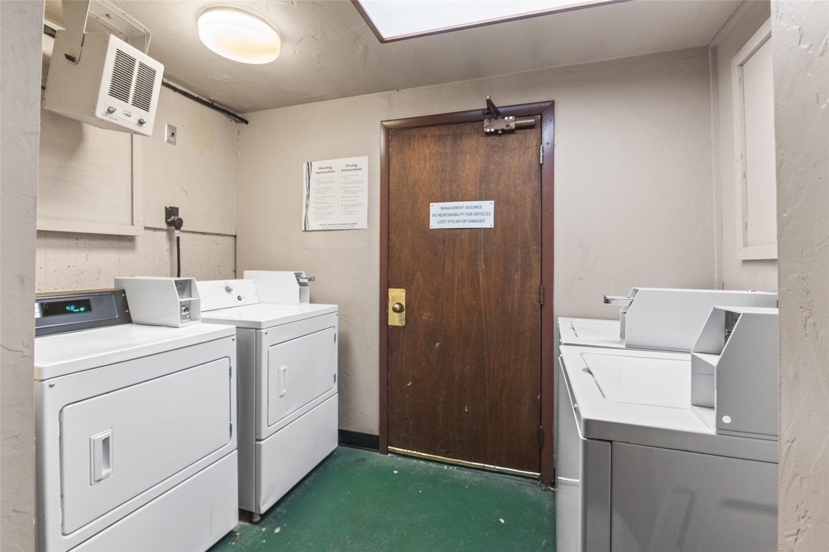 2025 Walton Creek Road, Unit 308 Steamboat Springs, CO 80487 - Photo 32 of 34 a utility room with dryer and washer