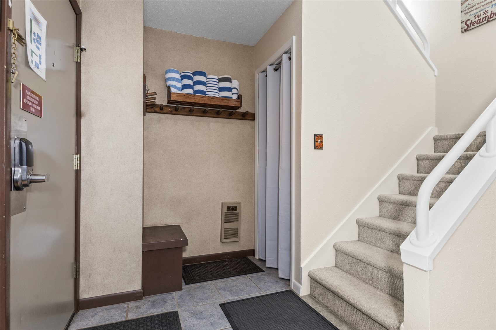 2025 Walton Creek Road, Unit 308 Steamboat Springs, CO 80487 - Photo 5 of 34 a view of entryway with stairs and furniture
