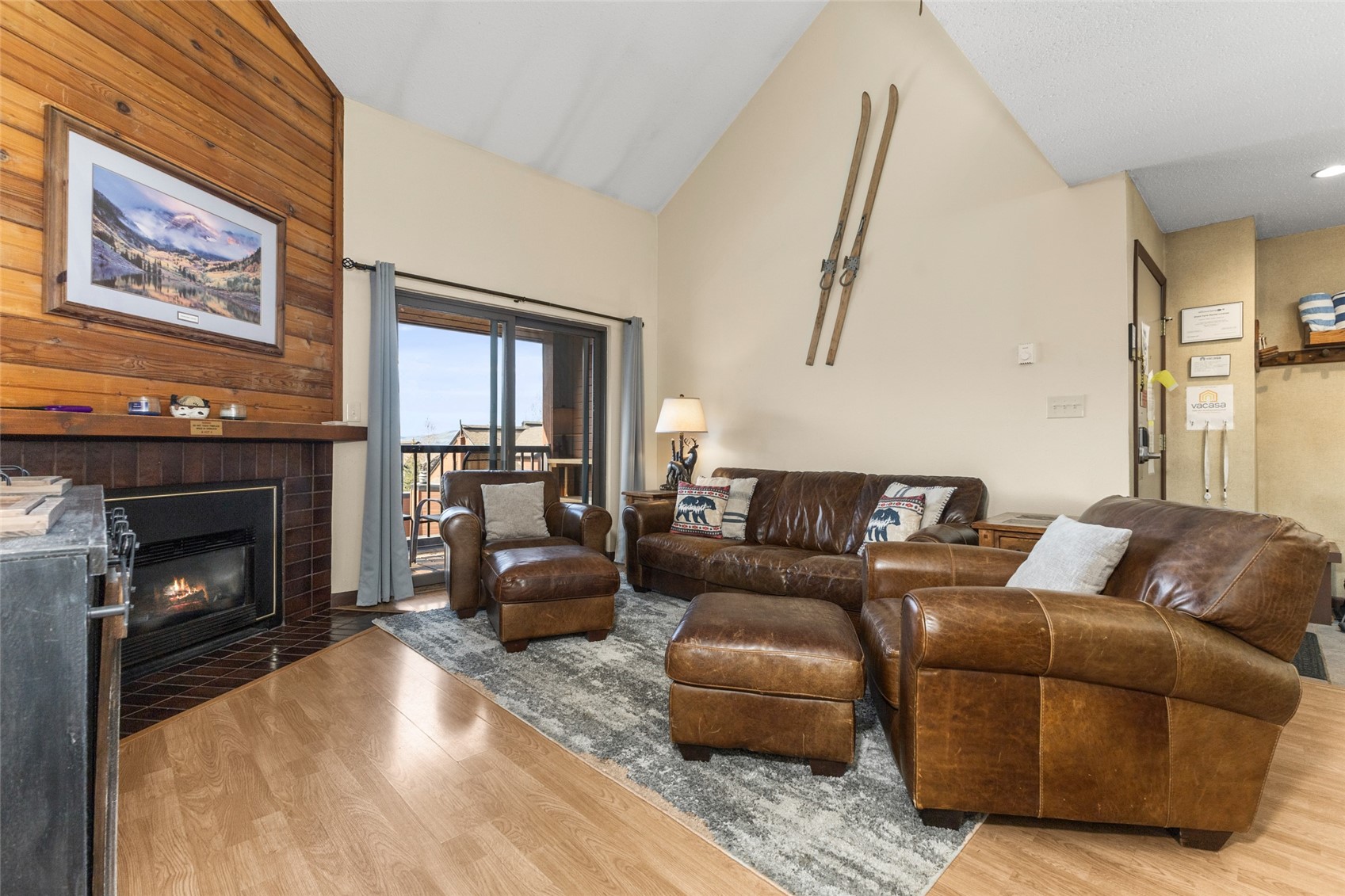 2025 Walton Creek Road, Unit 308 Steamboat Springs, CO 80487 - Photo 6 of 34 a living room with furniture and a fireplace