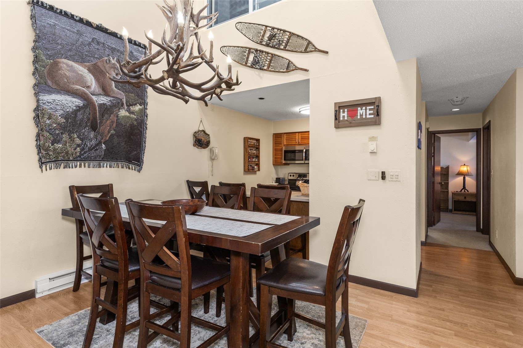 2025 Walton Creek Road, Unit 308 Steamboat Springs, CO 80487 - Photo 7 of 34 a view of a dining room with furniture and wooden floor
