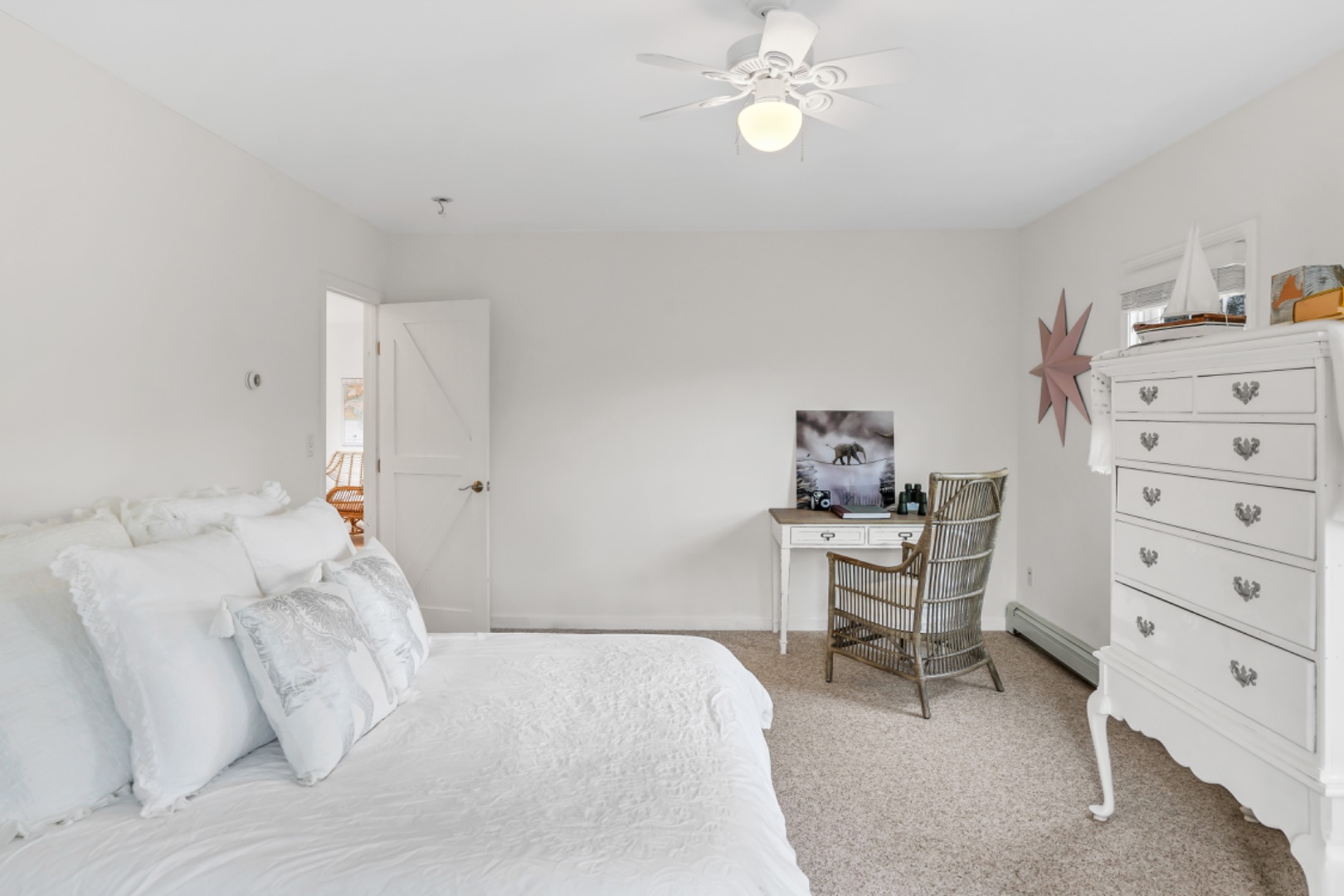 54 Lake Street Vineyard Haven, MA 02568 - Photo 11 of 30 a bedroom with a bed and a chair