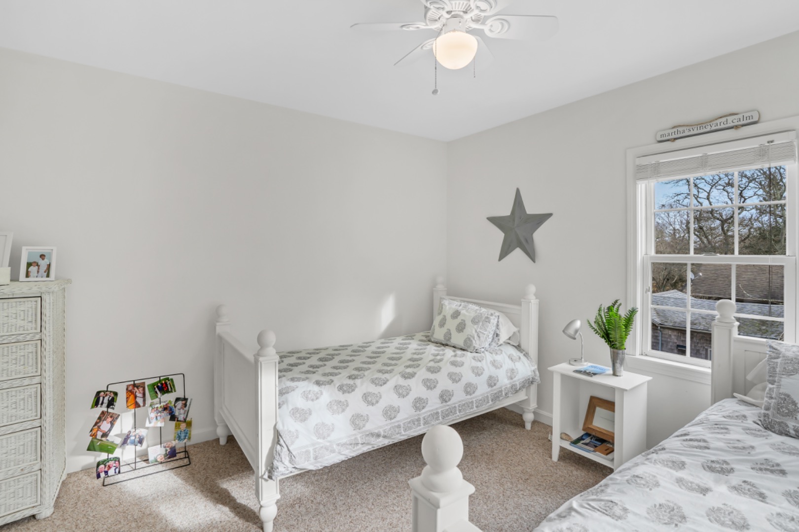 54 Lake Street Vineyard Haven, MA 02568 - Photo 13 of 30 a bedroom with a bed and a chandelier