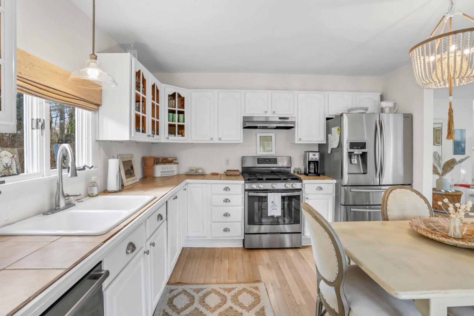 54 Lake Street Vineyard Haven, MA 02568 - Photo 16 of 30 a open kitchen with stainless steel appliances granite countertop a sink stove and refrigerator