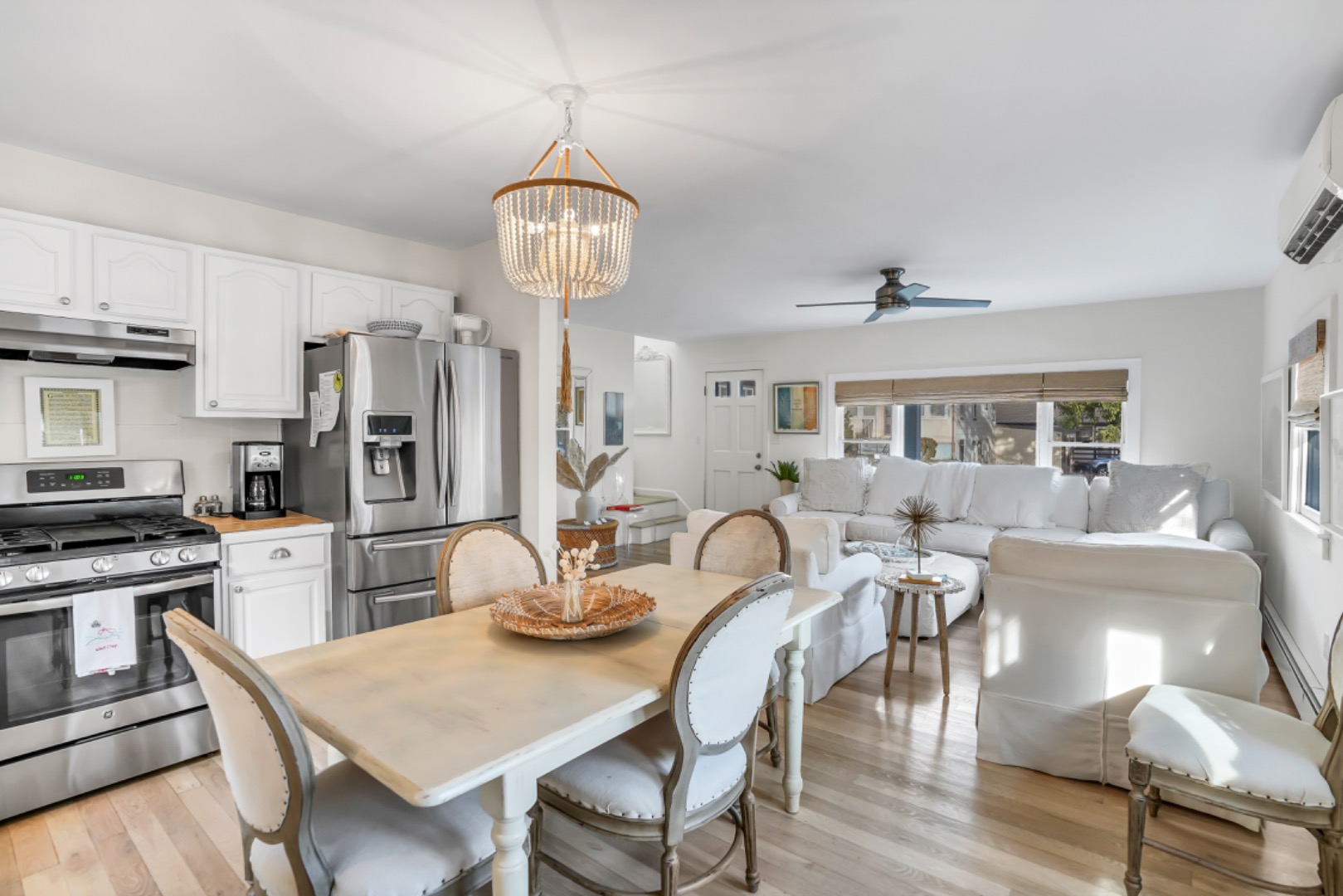 54 Lake Street Vineyard Haven, MA 02568 - Photo 18 of 30 a view of a dining room with furniture a chandelier and wooden floor