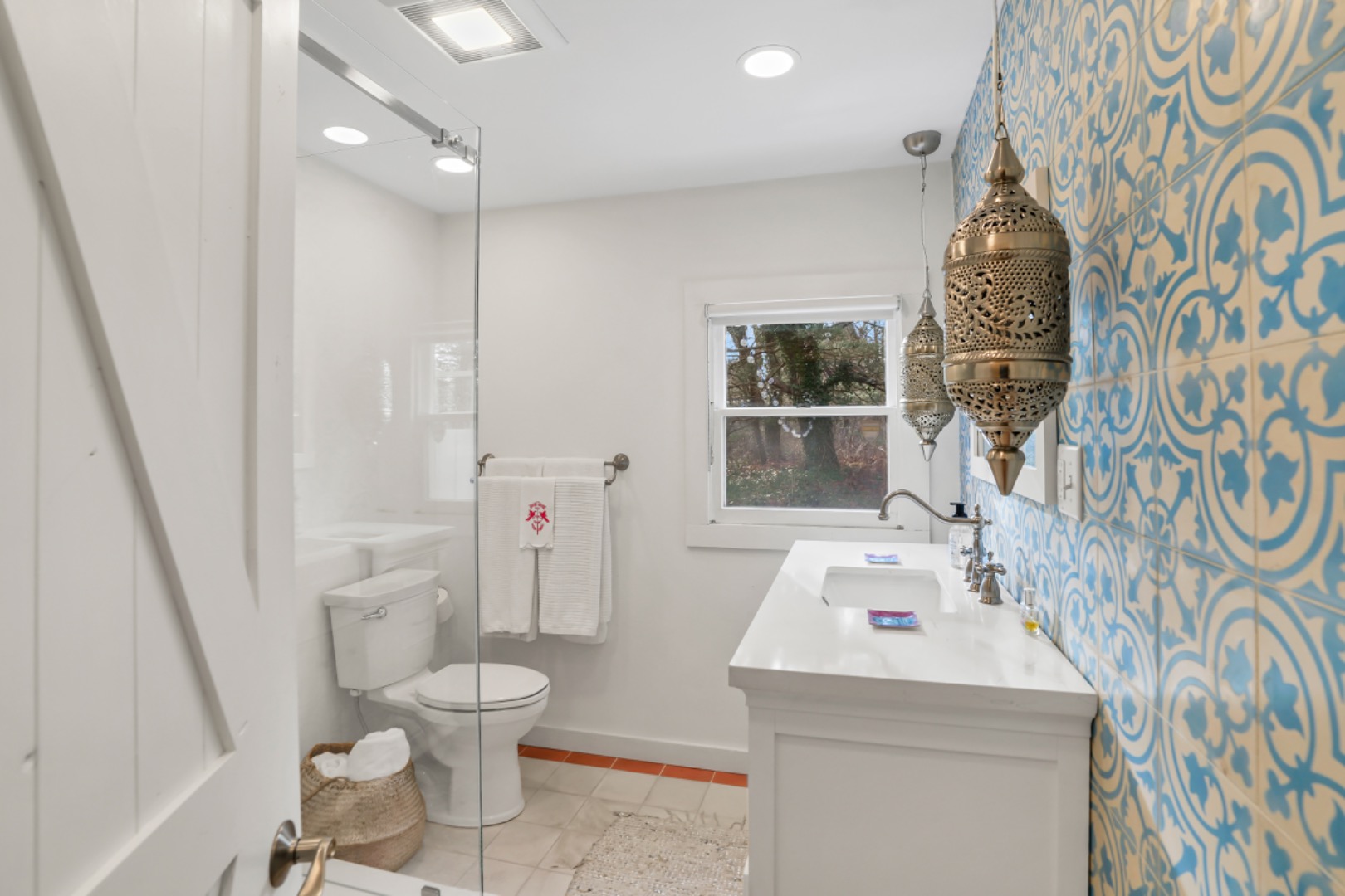 54 Lake Street Vineyard Haven, MA 02568 - Photo 22 of 30 a bathroom with a sink a toilet and a mirror
