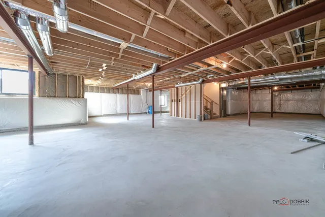 a view of empty room with wooden ceiling