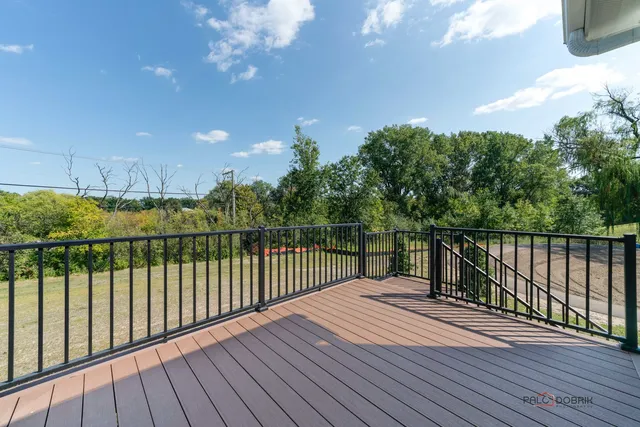 a view of balcony with wooden floor