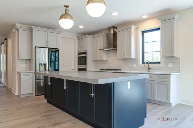 a kitchen with a sink cabinets and window