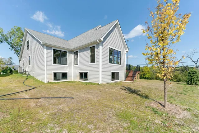 a view of house with yard
