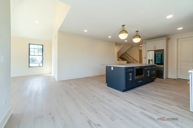 a room with a wooden floor and white walls