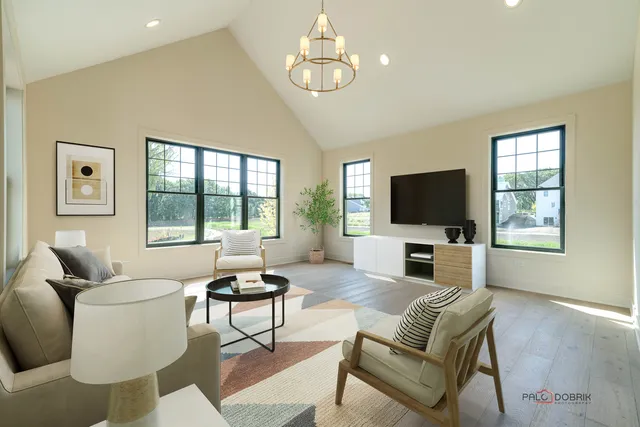 a living room with furniture a flat screen tv and a large window