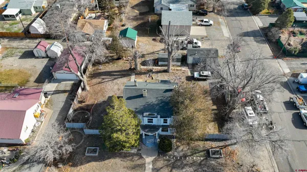 an aerial view of residential houses with outdoor space