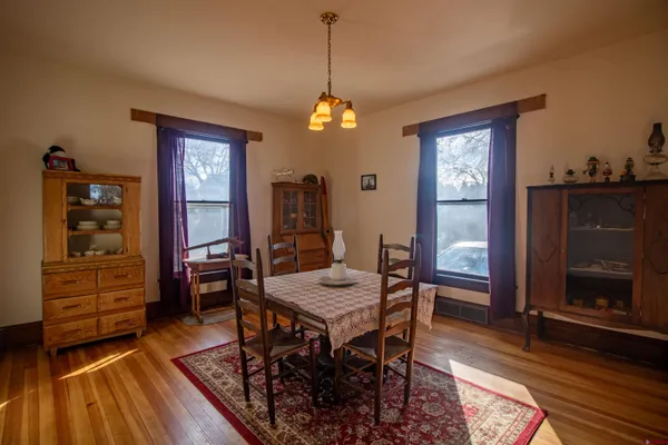 a living room with furniture rug and window