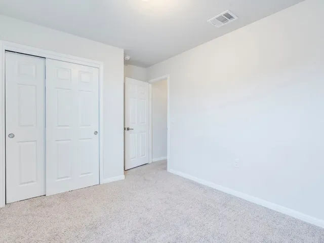a swimming pool with wooden fence