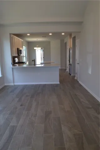 a view of a kitchen with a sink and a window