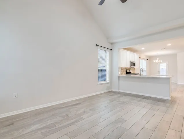 a living room with furniture and a large mirror