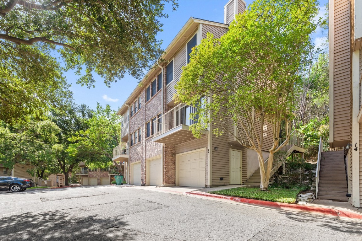 3845 Ranch Road 2222, Unit H1 ( 15) Austin, TX 78731 - Photo 1 of 1 a front view of a building with trees