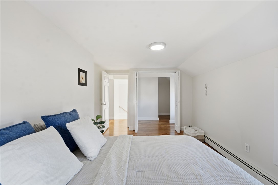 207 Mendon Road Cumberland, RI 02864 - Photo 12 of 22 Upstairs bedroom with walk in closet, refinished hardwoods, new mini splits