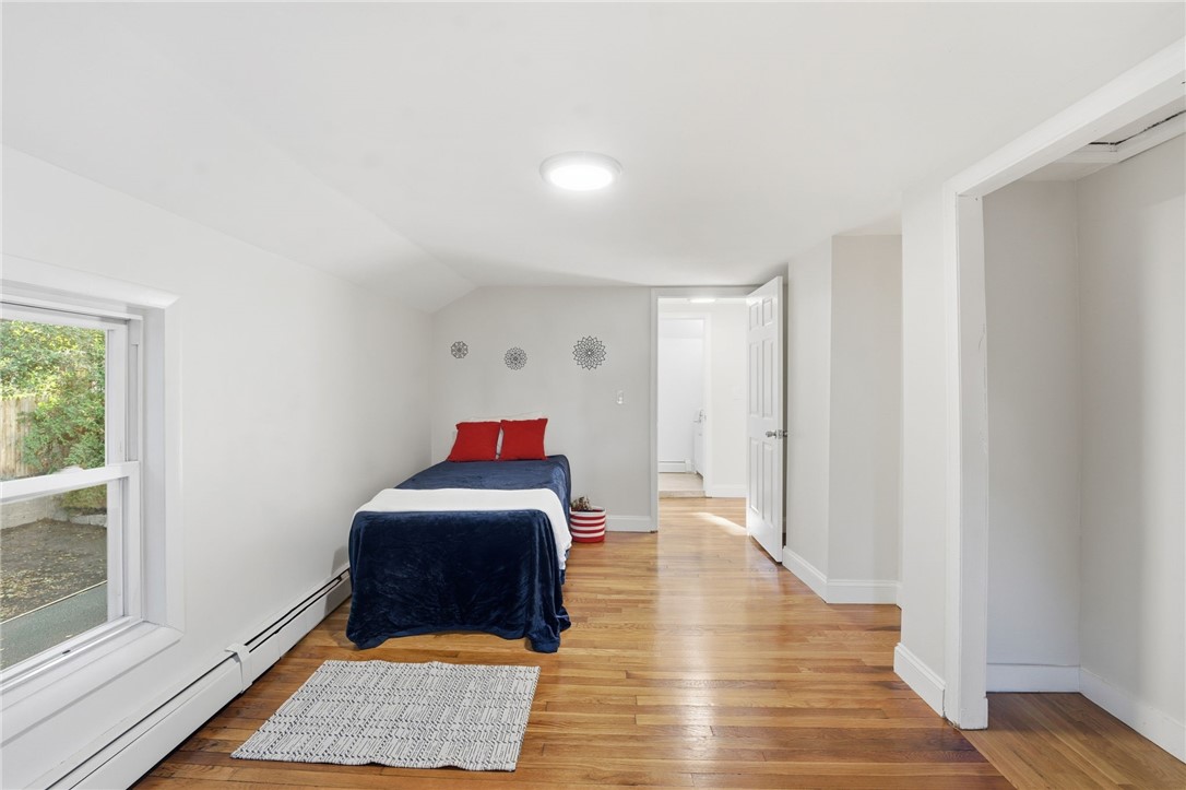 207 Mendon Road Cumberland, RI 02864 - Photo 18 of 22 Upstairs bedroom with large closet, refinished hardwoods, new mini split unit and LED lighting