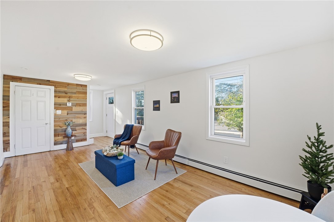 207 Mendon Road Cumberland, RI 02864 - Photo 3 of 22 Living room with feature wall and basement access